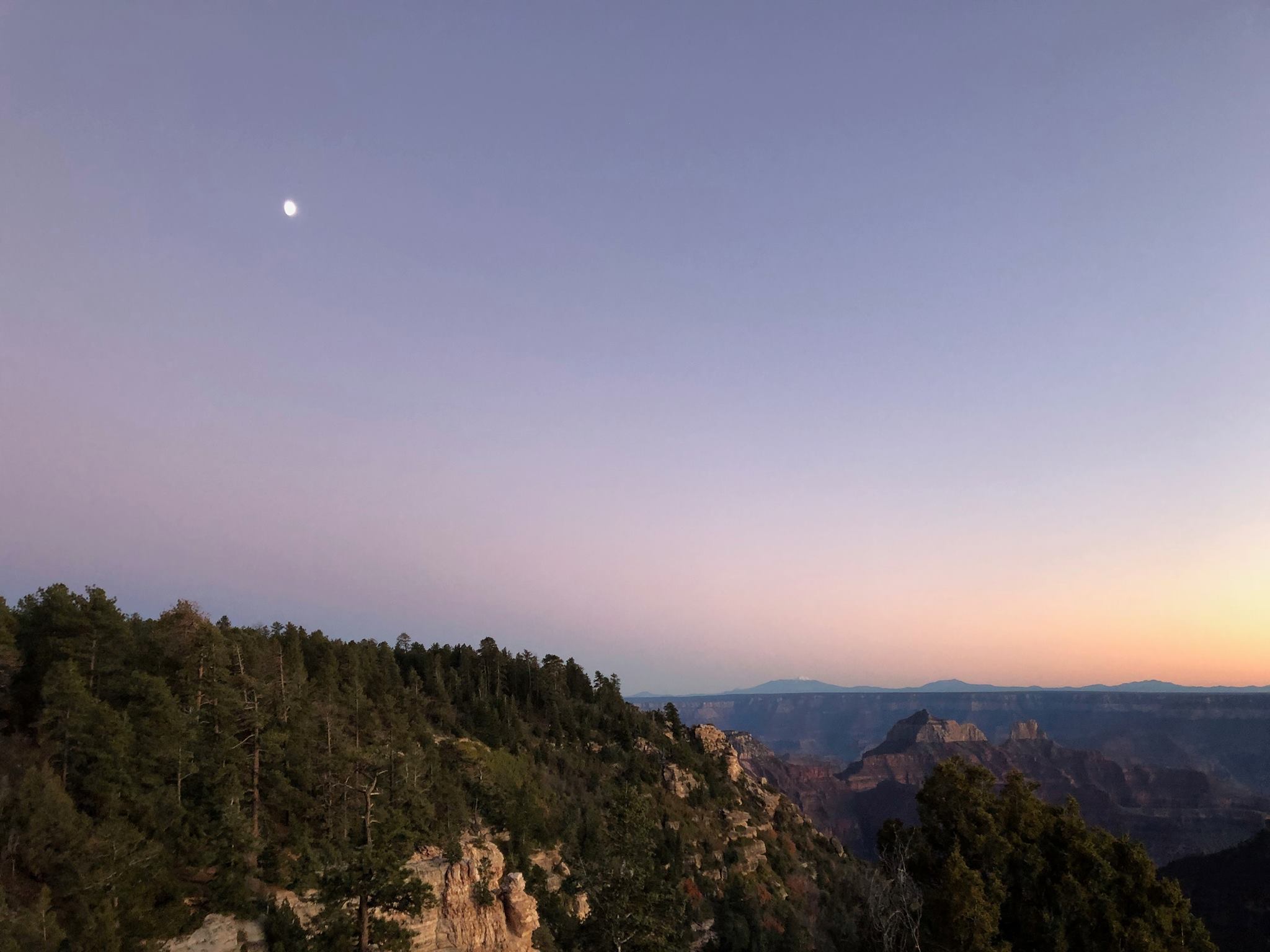 dusk with the moon over the north rim